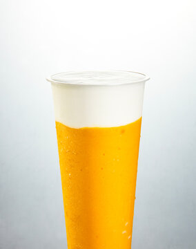 Mango milkshake drink on white background