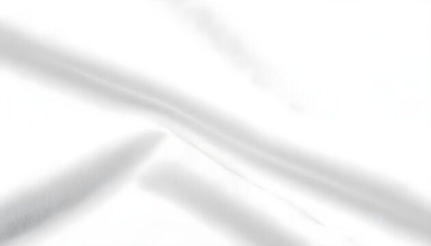 Close-up top-down shot of a white textured fabric with soft folds and shadows