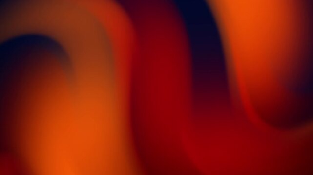 A soft and fluid abstract background featuring smooth transitions between deep red, vibrant orange, and dark black tones. This liquid-style motion graphic is ideal for modern creative projects and pre
