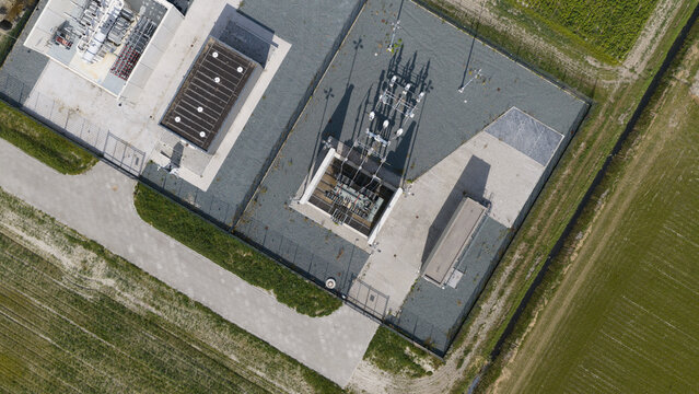 Aerial view of High Voltage Electrical Substation Surrounded by Farmland