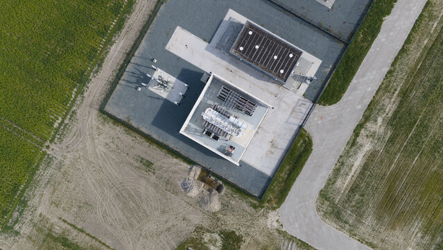 Aerial view of High Voltage Electrical Substation Surrounded by Farmland