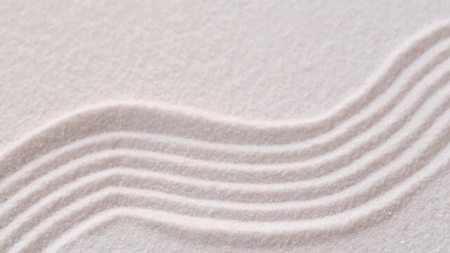 Making a pattern in white sand