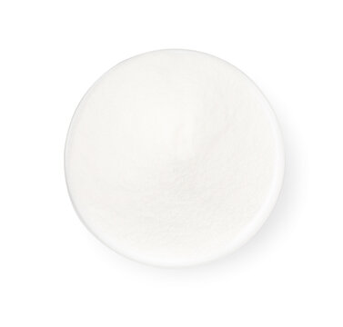 Baking soda in bowl isolated on white, top view