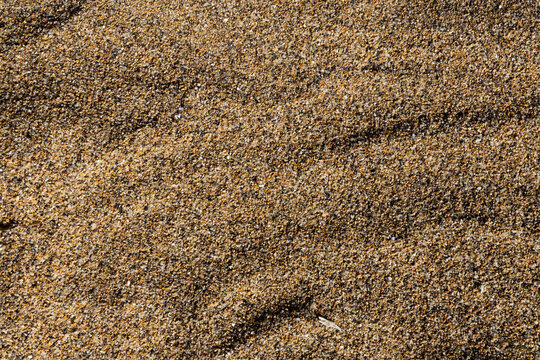 Sfondo sabbia di mare in piccoli ciottoli