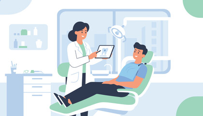 Fototapeta premium Female dentist holds a digital tablet showing a tooth x-ray to her male patient resting comfortably in the dental chair.