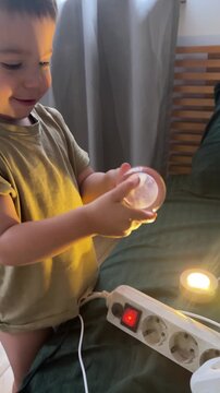 Toddler playing with glowing lights