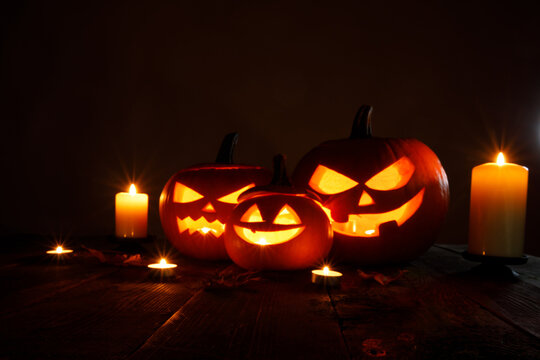 Halloween pumpkin lantern with burning candle inside