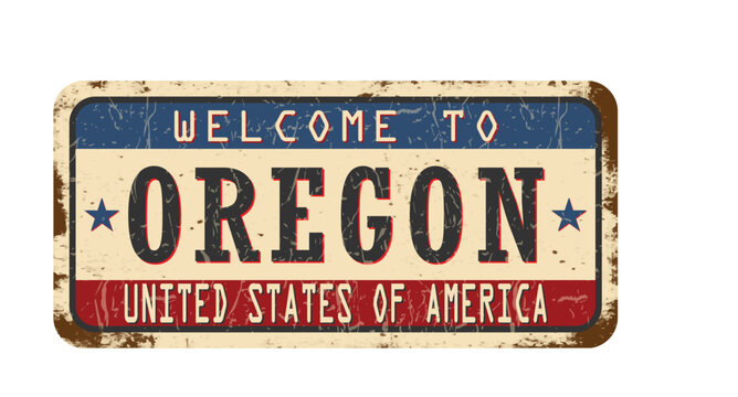 Welcome to Oregon. An old worn sign with an inscription. Welcome metal plaque with rust elements
