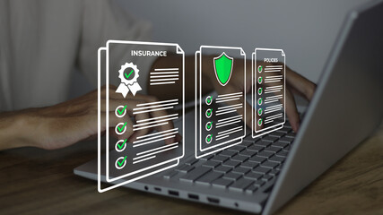 businessman reviewing digital insurance policy documents on laptop with contract ribbon, shield,...