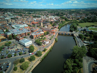 Fototapeta premium WORCESTER, WORCESTERSHIRE, ENGLAND - An aerial drone view looking over Worcester Bridge and the River Severn in the historic city centre.