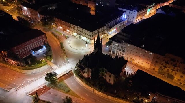 Night aerial footage of Mlynsk&aacute; ulica in Ko&scaron;ice, Slovakia, featuring the illuminated historic city center. The drone view captures Mlynsk&aacute; Street leading toward St. Elisabeth Cathedral (D&oacute;m sv&auml;tej Alž