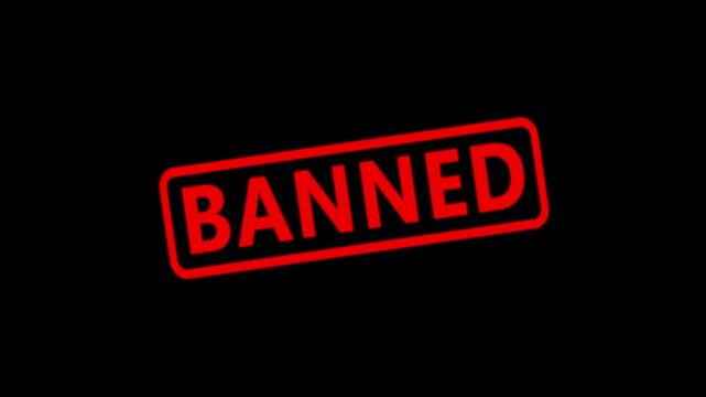 Banned red rubber stamp effect on black background, prohibited concept motion forbidden restricted.