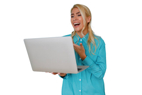 Blonde woman laughing while holding a laptop, communicating online, showing happiness and success, transparent background