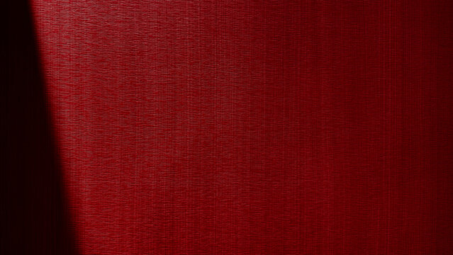 Deep red textured wallpaper background with dramatic diagonal shadow light beam, elegant dark crimson paper material pattern backdrop for luxury graphic design, Christmas, and Valentines Day.