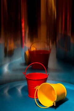 Red and yellow bucket on an abstract background