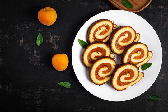 Apricot Jam Sponge Roll Cake Top View with Copy Space