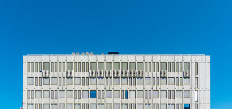 Oslo midcentury modern building facade against blue sky