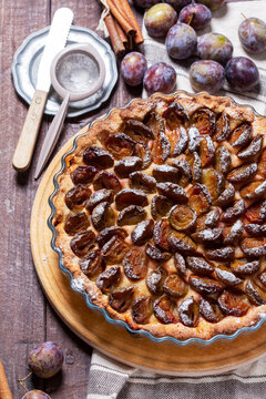 German plum cake with cinnamon, served with ice cream and coffee.