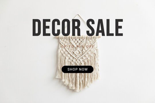 A detailed bohemian macrame wall hanging with intricate knot patterns a wooden dowel rod and an eye-catching promotional overlay that reads Decor Sale Up To 50% Off and a Shop Now button
