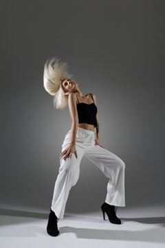 Dynamic Modern Dancer Performing Jazz-Funk Moves in Stylish Outfit