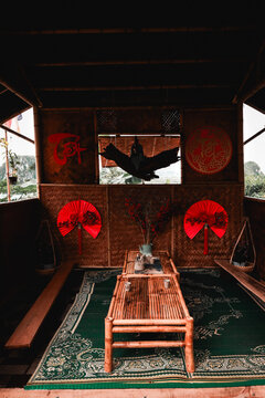 View of a traditional bamboo tea house decorated for Tet with red fans and calligraphy, overlooking The Marble Mountains in Da Nang, Da Nang, Vietnam.