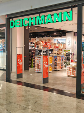 Alicante, Spain - June 30, 2026: Retail store entrance with bright green sign reading DEICHMANN. Deichmann is major German footwear retail chain that offers variety of affordable shoes and accessories