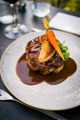 French Tournedos Rossini beef steak topped with pan-seared foie gras, demi-glace sauce, and baby carrot © Hiang