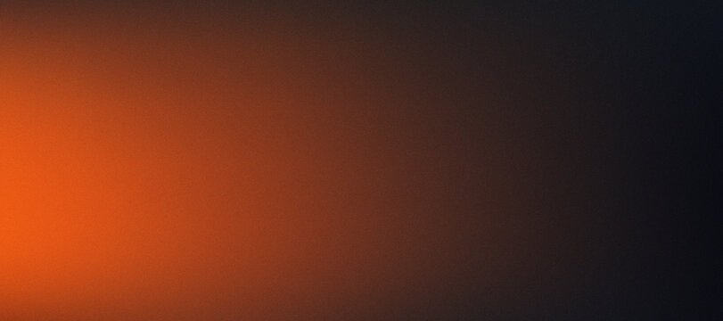 Glowing orange and black grainy gradient background texture