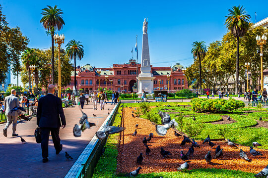 Buenos Aires, Argentina - April 12, 2020: View of the Plaza de Mayo in Buenos Aires, Argentina, featuring the iconic pink Casa Rosada presidential palace and the central Pyramid of May 