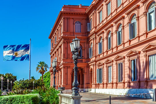 Buenos Aires, Argentina - April 12, 2020: Casa Rosada, the official seat of the executive branch of the government of Argentina, located in Buenos Aires, with the Argentine flag waving.