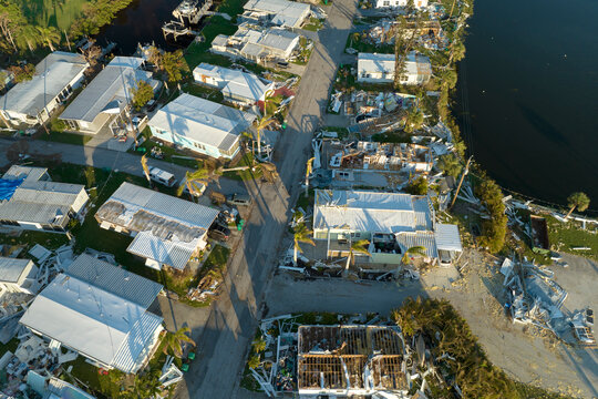 View from above of destroyed by hurricane Ian suburban houses in Florida mobile home residential area. Consequences of natural disaster