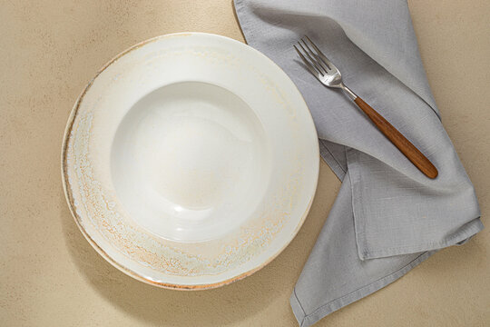 Empty Ceramic Plate Flat Lay with Fork and Linen Napkin Table Setting