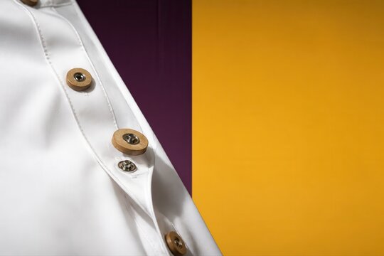 Medical branding with white coat button detail and color block background