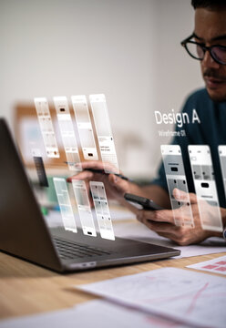 A male designer working on website prototype, in UX UI concept design and development for a website and mobile app prototype, with hologram interface