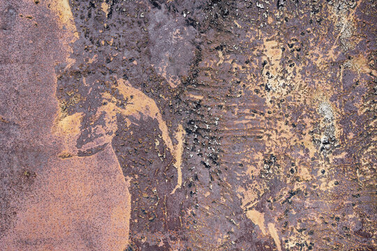Patterns in rust on an old metal door.