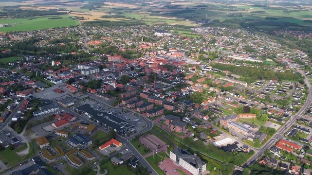 An aerial panorama beside the old town above the city Aars on a sunny summer afternoon in Denmark	