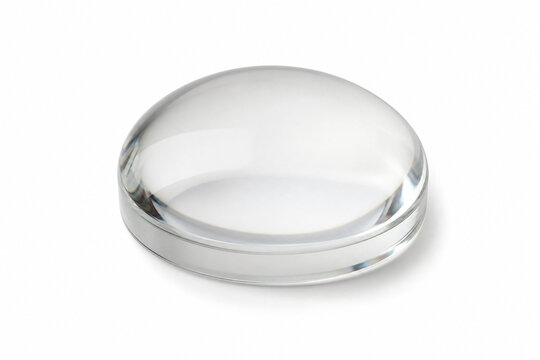 Plain glass lens paperweight isolated on seamless white background