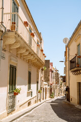 Sunlit Via Archimede Italian street in the historic centre of Noto, Sicily, southern Italy © Nicholas