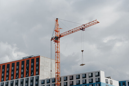 construction crane over high-rise multi-storey building, building construction