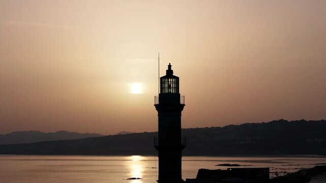  View of Chania with the amazing lighthouse, mosque, venetian shipyards, Crete, Greece.Waves crashing on lighthouse, Beautiful Greece and best scenic places - panorama