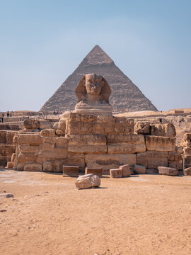 View of the Great Sphinx and the Pyramid of Khafre at the Giza Necropolis under a clear blue sky in Al Haram, Giza Governorate, Egypt.