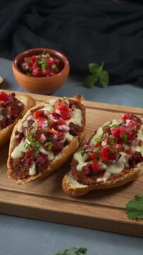 Gourmet Mexican Molletes with Chorizo, Melted Cheese and fresh pico de gallo