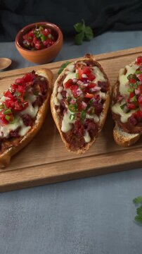 Molletes Toast with beans, melted cheese, choriza and spicy tomato salsa
