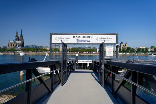 Cologne, Germany July 25 2026: View from a gangway at the Eichberger jetty in Cologne-Deutz towards the Rhine river and the historical city skyline. Sunny summer day