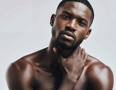 Confident young Black man with smooth skin and beard in a close-up portrait