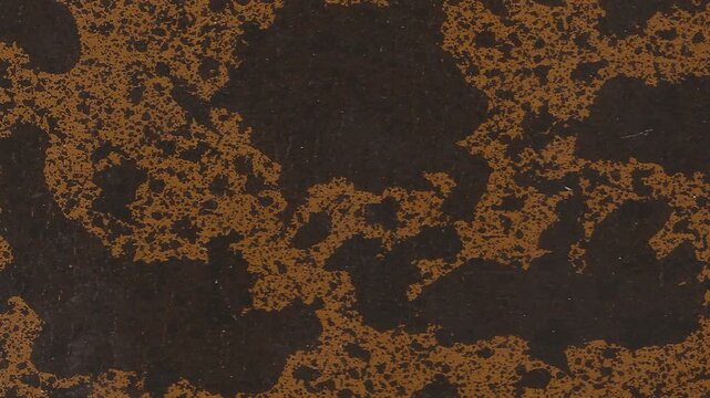 4k vertical slow motion footage of antique dark brown leather texture with golden oxidized areas, specs, scratches and other rough features