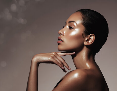 Elegant Woman with Radiant Glowing Skin and Slicked Back Hair Profile View
