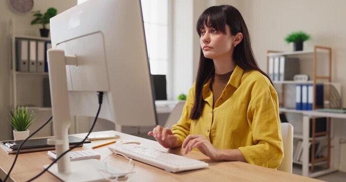 Woman accountant analyst reviews finance paperwork on computer. She enters data and checks reports in the office, organizing bills records. Financial management planning consulting business concept.