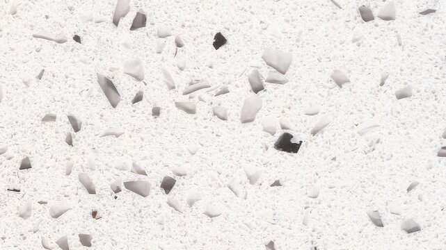 4k vertical slow motion footage of classic white stone texture with big and small shiny quartz crystals 