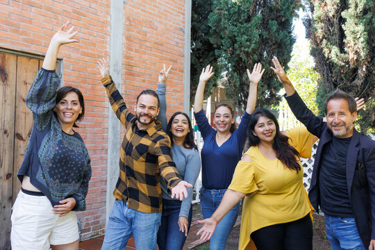 group of latin and multigenerational people or family together in a terrace outdoors in Mexico Latin america. Portrait of diverse hispanic group of friends